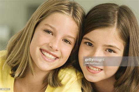Portrait Of Two Girls Smiling Photo Getty Images