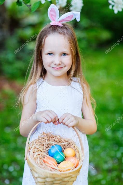 Little Girl Playing With Easter Eggs Stock Photo By ©shalamov 61942485