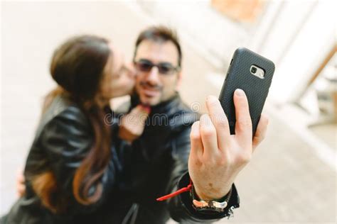 Couple In Love Doing A Self Portrait Selfie With The Mobile Phone Stock