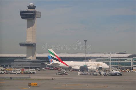Air Traffic Control Tower And Emirates Airlines Airbus A380 At John F