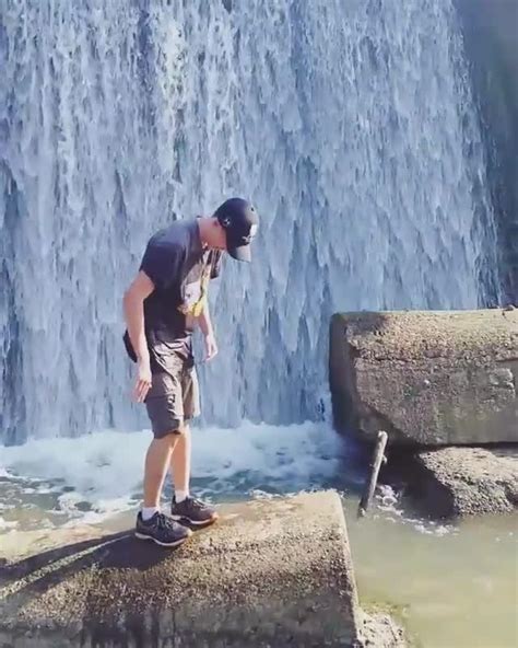 Guy Jumps On Friend In Waterfall Pond Jukin Media Inc