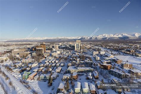 Aerial View Of Snow Covering Downtown Anchorage And The Chugach