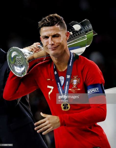 L R Cristiano Ronaldo Of Portugal With The Nations League Trophy