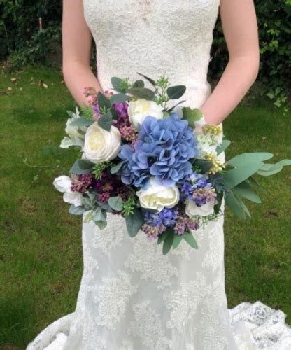 Poppy Blue Bridal Bouquet | Purple bridal bouquet, Bridal bouquet blue, Purple wedding bouquets