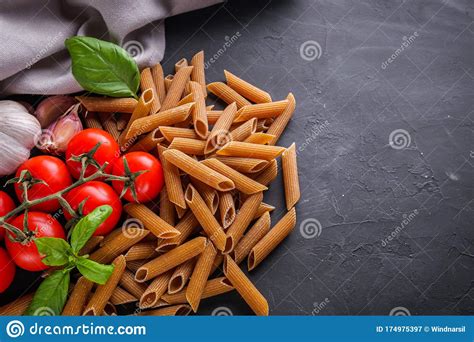Concept Of Traditional Italian Pasta With Tomatoes And Basil Stock