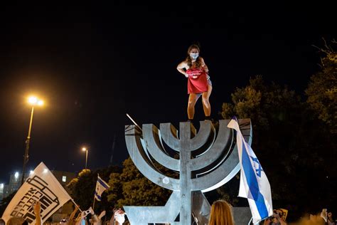 Israel Topless Protester On Menorah Outside Knesset Stirs Fury I News