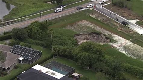 Massive Sinkhole Opens Near Florida Homes Closes Roads Fox Weather