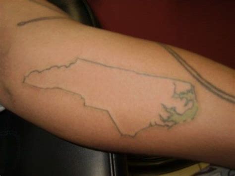 American flag tattoo designs are very popular in the united states. North Carolina with blacklight outline | Tattoo | Pinterest | Pictures, South carolina and ...