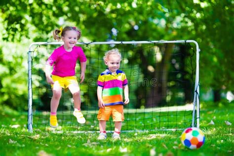 Kids Playing Football In School Yard Stock Image Image Of Green