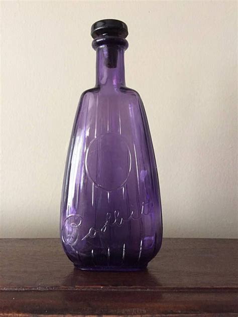 Antique Amethyst Bottle Cosmetic Bottle Embossed With Bobbitts