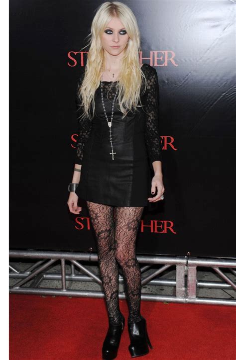 A Woman With Long Blonde Hair And Black Tights At A Red Carpeted Event