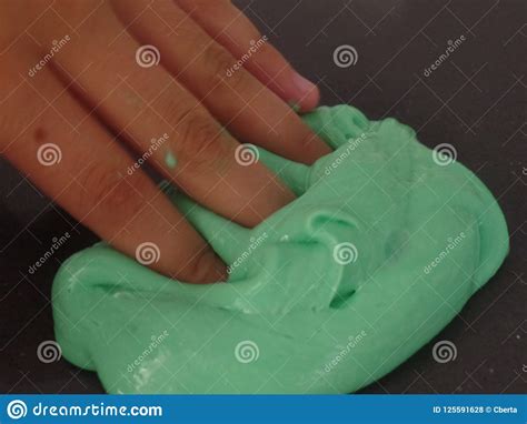 Child S Hand Poking Bright Green Slime Stock Photo Image Of Passion