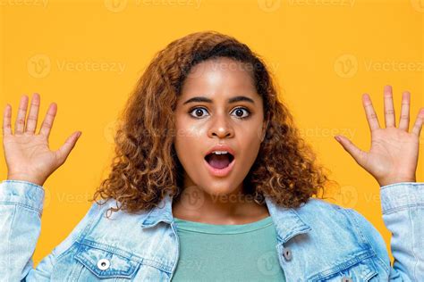 Shocked Young African American Woman Gasping With Hands Up Isolated On Yellow Background 5346344