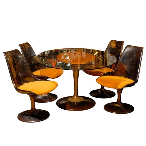 20.5''l x 23.25''w x 32.5''h seat dimensions: Mid-Century Tulip Shaped Table and Four Chairs at 1stDibs