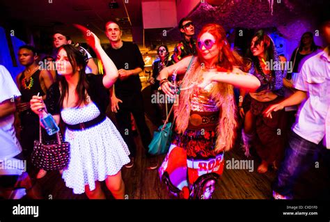 Young People Dancing At A Neon Voodoo Tribal Themed Rave Dance