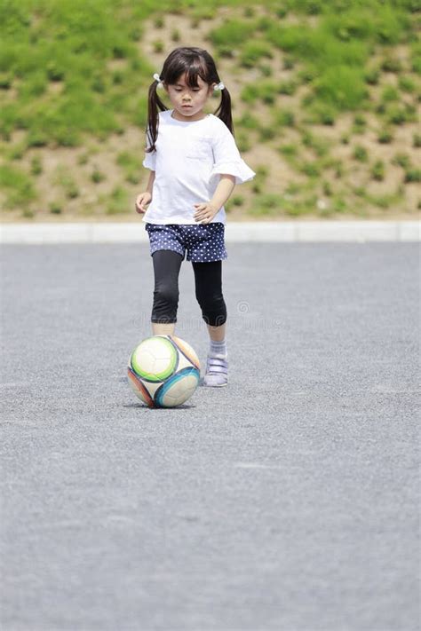 Japanese Girl Dribbling Soccer Ball Stock Photo Image Of Ground