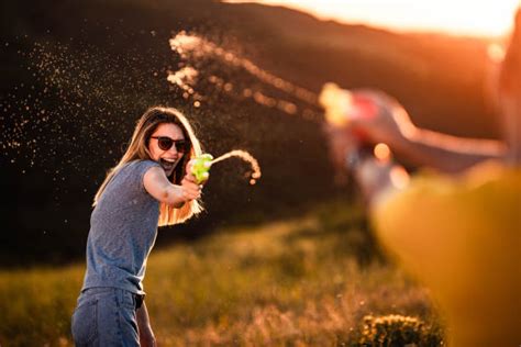 700 Adult Water Gun Fight Stock Photos Pictures And Royalty Free Images