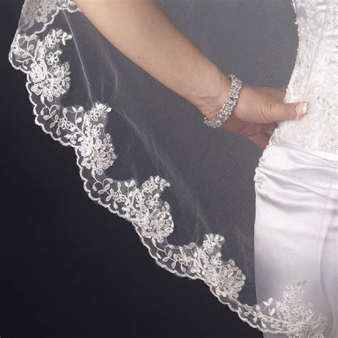 fingertip length wedding veil with beaded scallop floral embroidery fingertip length wedding