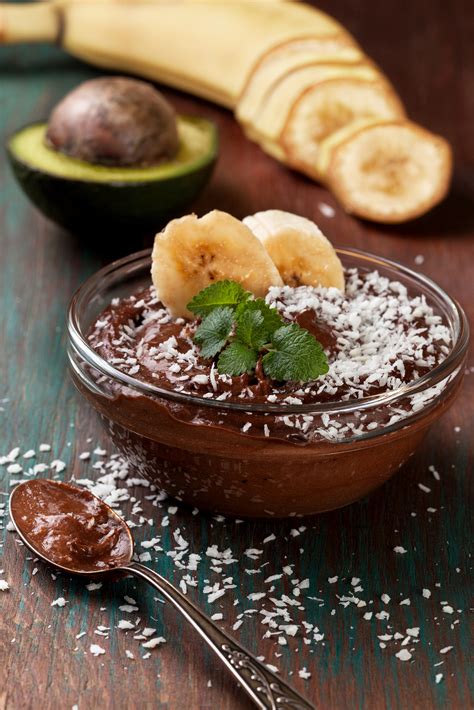 Raw Vegan Avocado Banana Pudding With Coconut Crumbs In A Glass Bowl