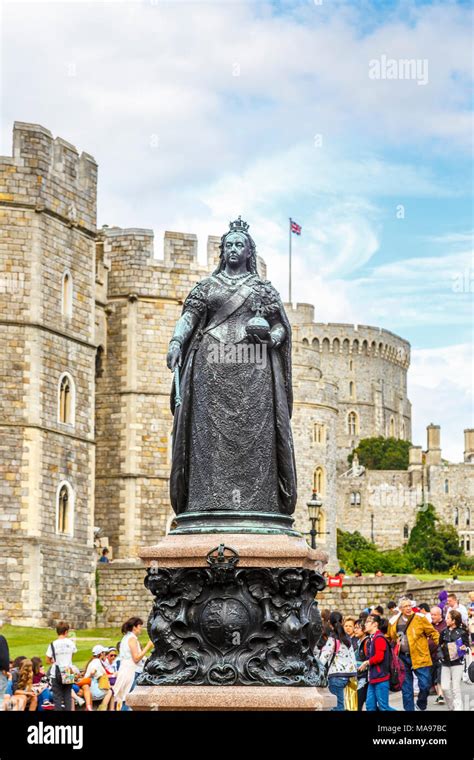 Statue Of Queen Victoria Outside The Walls And Entrance To Windsor