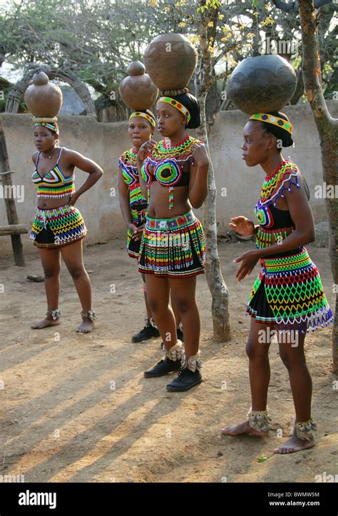 Zulu Girls Wearing Traditional Beaded Dress And Carrying Pots On Their Heads Shakaland Zulu