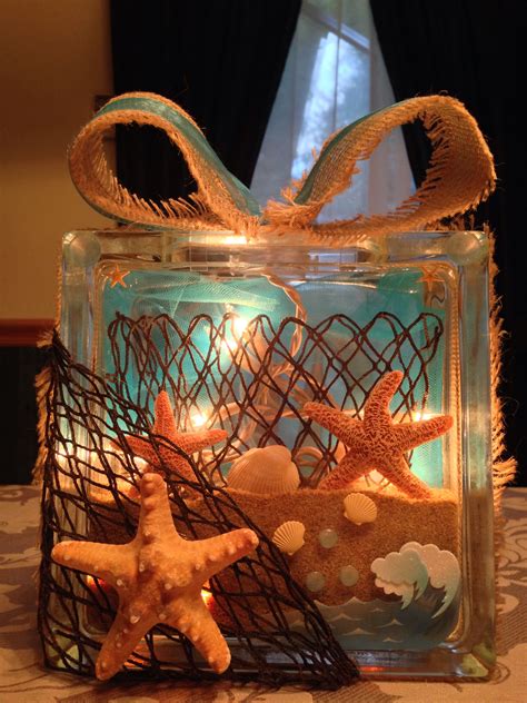Maybe you would like to learn more about one of these? Beach theme glass block with sand, lights, net, and burlap ...
