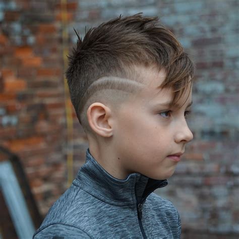While most pictures depict it with straight hair, it also works great for curly hair. Boy's Fade Haircuts: 22 Cool And Stylish Looks For 2021