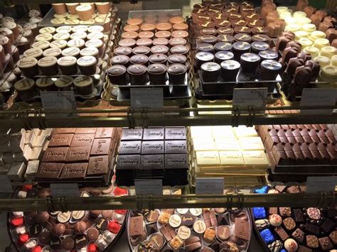 A Display Case Filled With Lots Of Different Types Of Chocolates