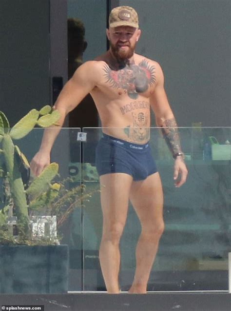 shirtless conor mcgregor displays his muscular tattooed physique in miami