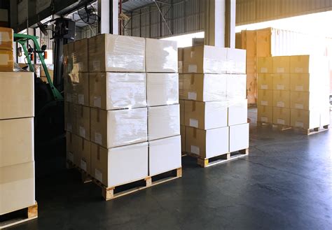 Interior Of Warehouse With Stack Package Boxes On Pallets Warehouse