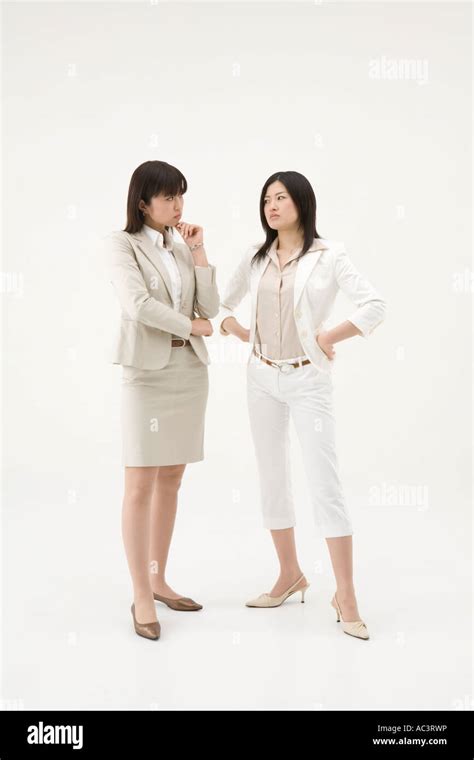 Two Businesswomen Glaring At Each Other Stock Photo Alamy