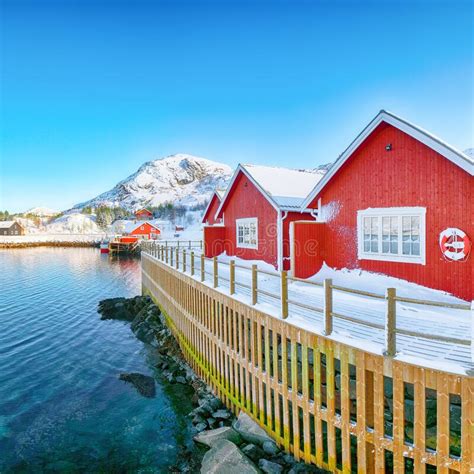 Traditional Norwegian Red Wooden Houses On The Shore Of Sundstraumen