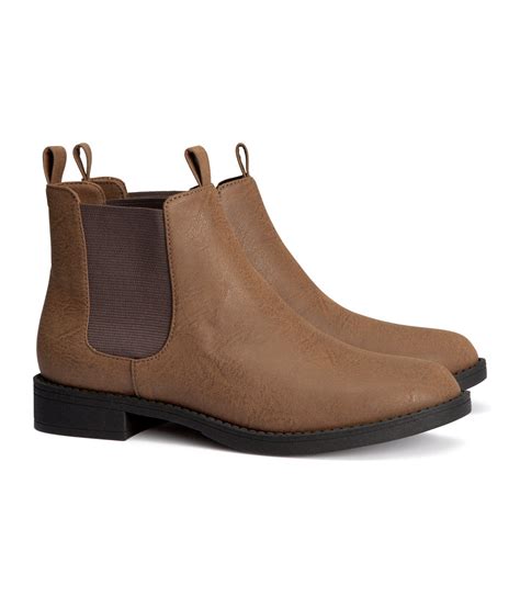 Chelsea, biker, and hiking boot silhouettes are among the trend focuses for flat ankle boots this season, with chunky track soles and metallic hardware. H&M Chelsea Boots in Brown - Lyst