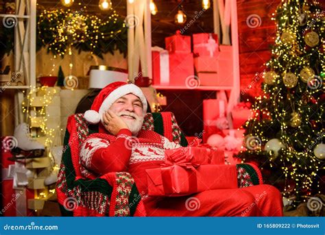 Santa Claus Relaxing In Arm Chair Bearded Senior Man Santa Claus