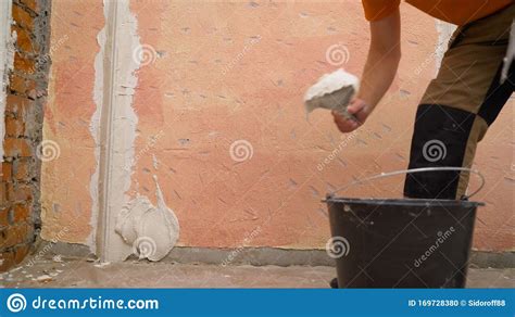 Plasterer Putting Plaster On Wall. Putting Plaster On The 