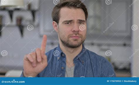 Portrait Of Young Man Saying No By Finger Sign Stock Image Image Of