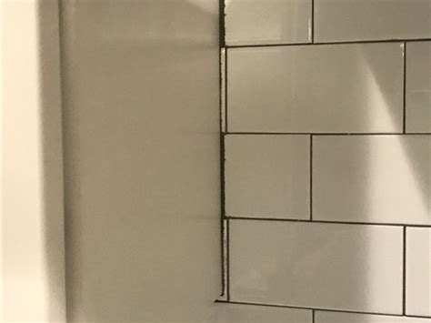Enter your zip code & get started! Bad tile job...help! Grout dark in certain areas/chipped ...