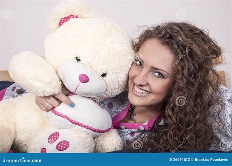 Pretty Young Woman In Pajamas With Teddy Bear Stock Photo Image Of