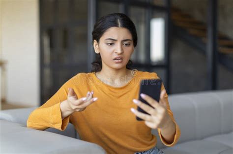 Spam Mailout Annoyed Young Indian Female Looking At Smartphone Screen Stock Image Image Of