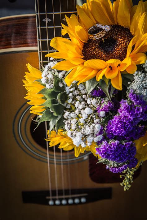 Flowers for wife on wedding day. Our rings, our flowers and my guitar on our wedding day ...