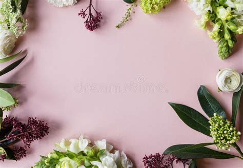 Various Fresh Flowers Arrangement In Metallic Vase On Wooden Tabl Stock