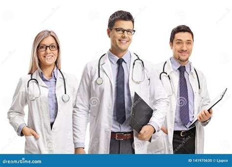 Team Of Young Doctors Posing And Smiling At The Camera Stock Photo