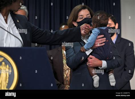 New York Gov Kathy Hochul R Holds The Infant Son Of New York State Assembly Member Phara