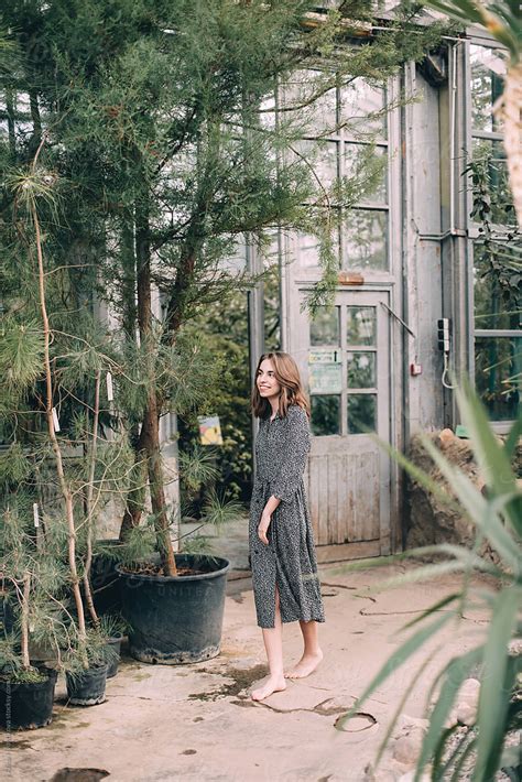 Charming Woman Enjoying Fresh Flowers By Stocksy Contributor Alina Hvostikova Stocksy