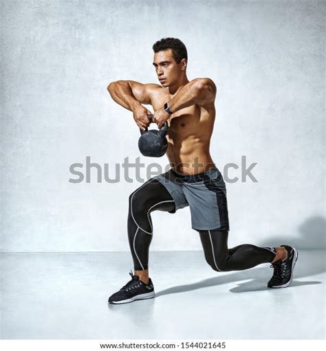 Sportive Man Workout Kettlebell Doing Lunges Stock Photo Edit Now