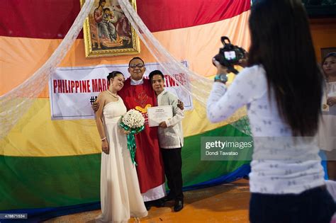 A Filipino Lgbt Couple Poses For A Souvenir Photo With A Priest News