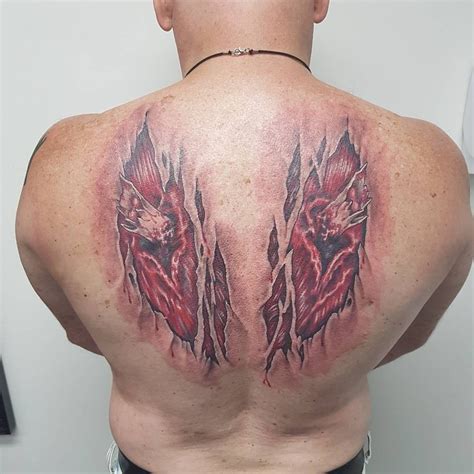 broken wings tattoo done in 1 day original piece by caught from timless culture tattoo