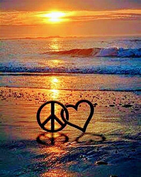 Peaceful Sunset With Peace Signs In The Sand