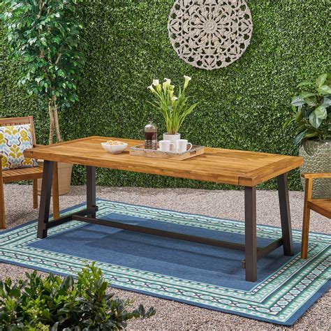 Kamden Outdoor Eight Seater Wooden Dining Table Teak And Rustic Metal