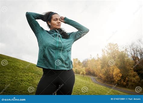 Stretch More Go Further An Attractive Young Woman Stretching While